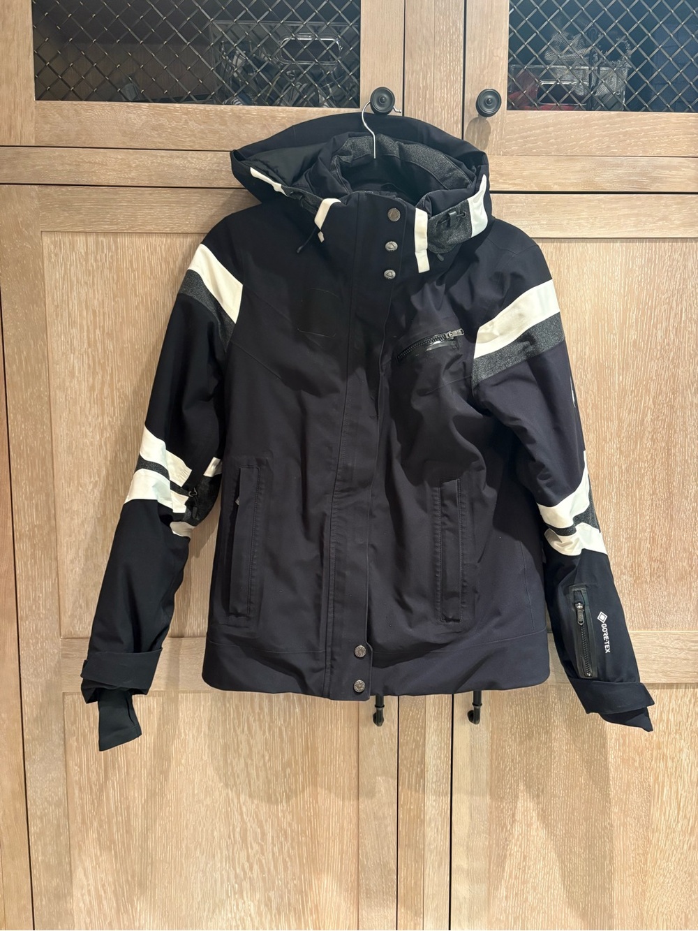 Spyder Black Women’s Ski Jacket with White Stripe Accents - Hooded Winter Shell